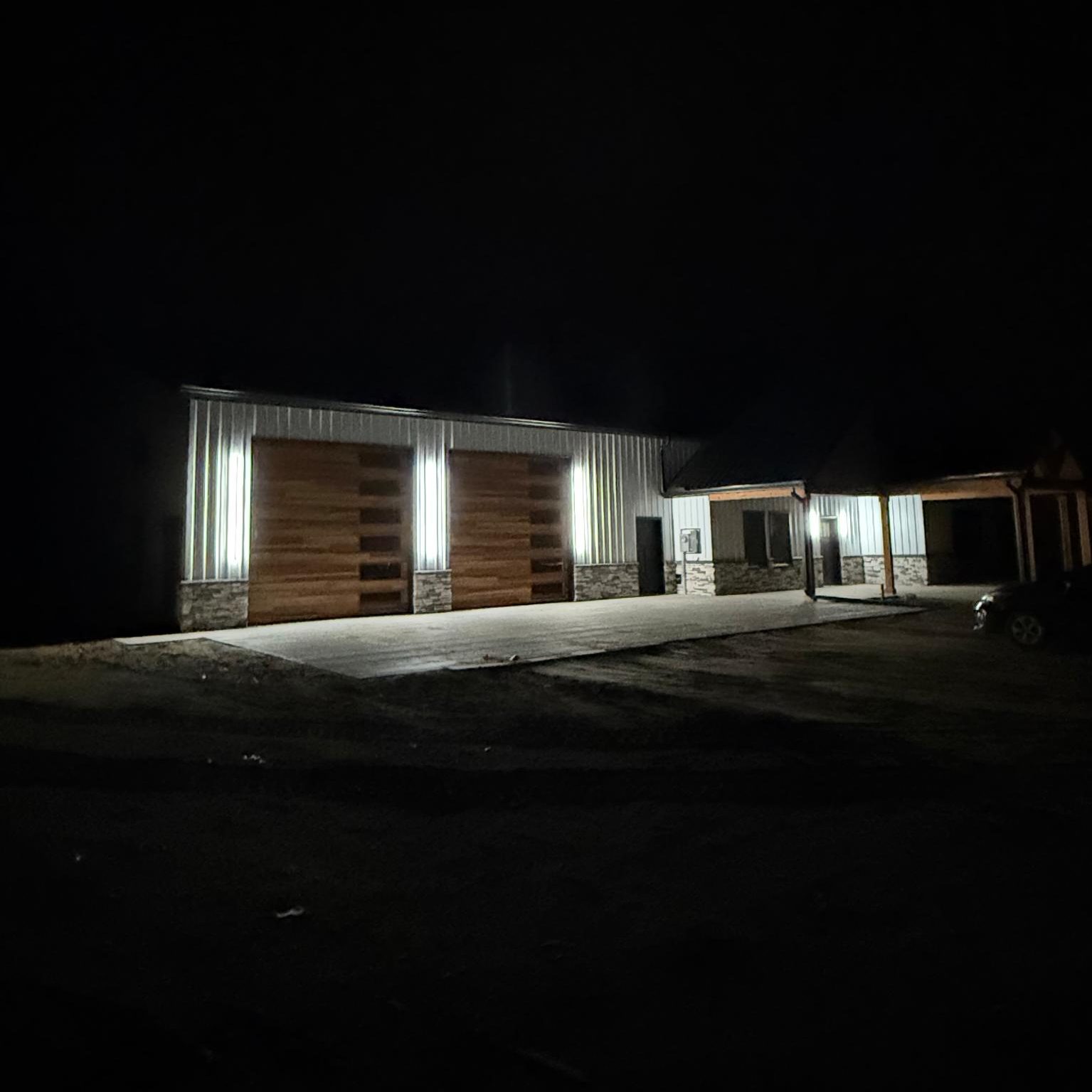 Commercial building illuminated at night by exterior lighting installed by KAB Electric